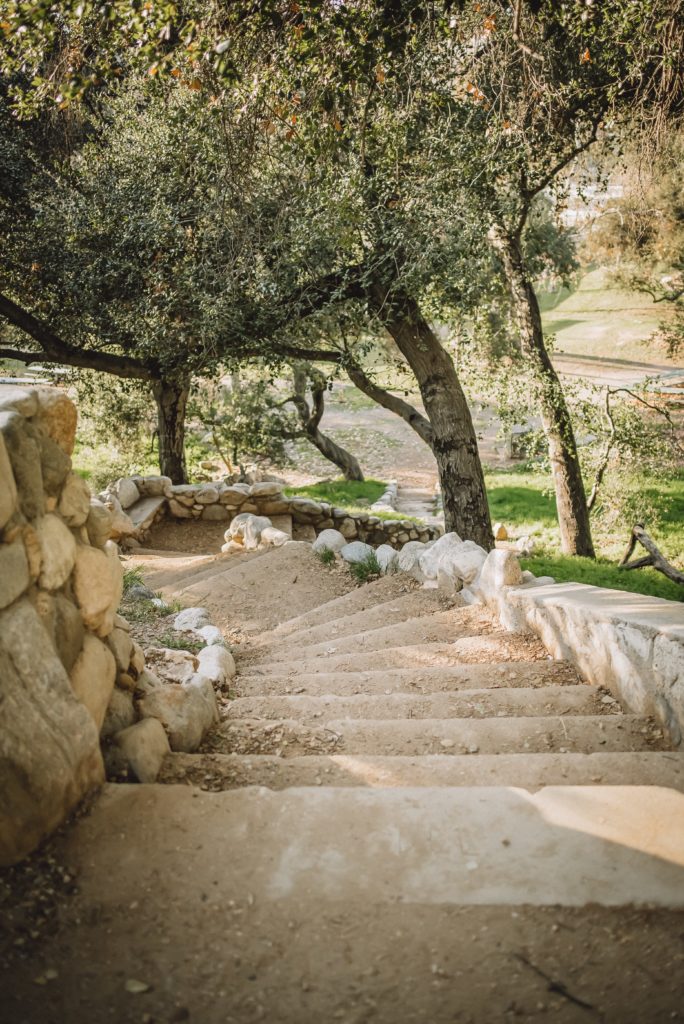 Stairway with cobbled stone walls on trail at Brookside Park in Pasadena